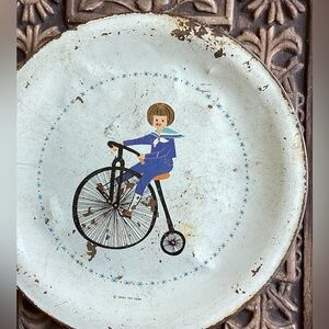 BOY RIDING BICYCLE VINTAGE IDEAL TOY CORP. Plate  6” METAL PLATE DISTRESSED